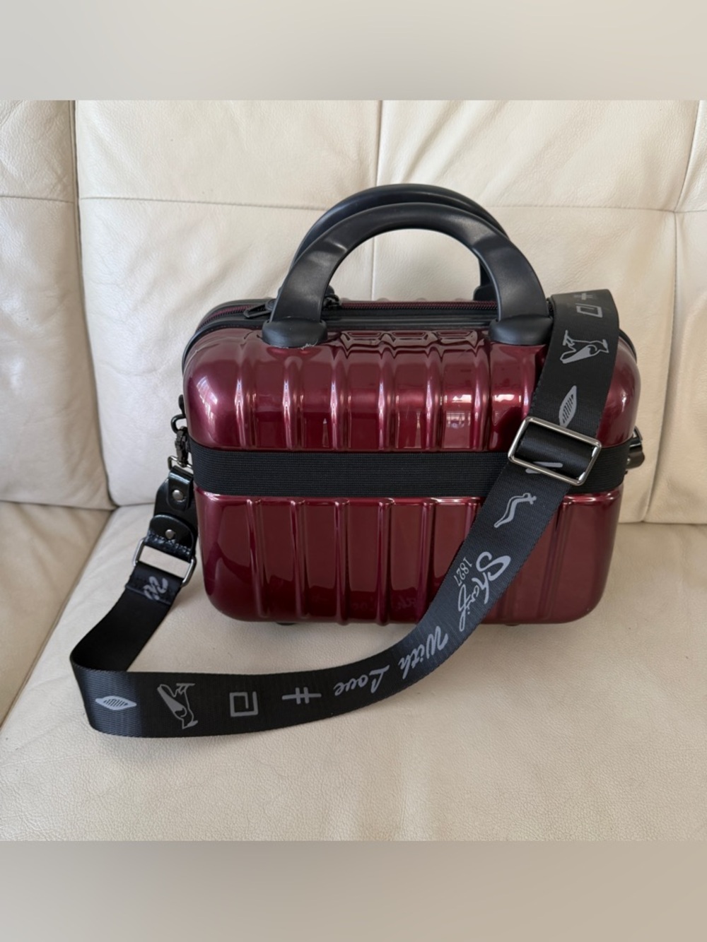 Burgundy hard-shell bag